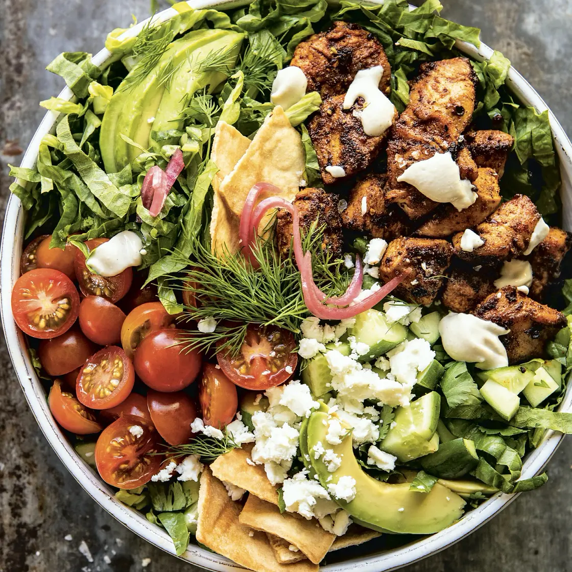 spiced chopped chicken salad with pita crisps and tahini vinaigrette