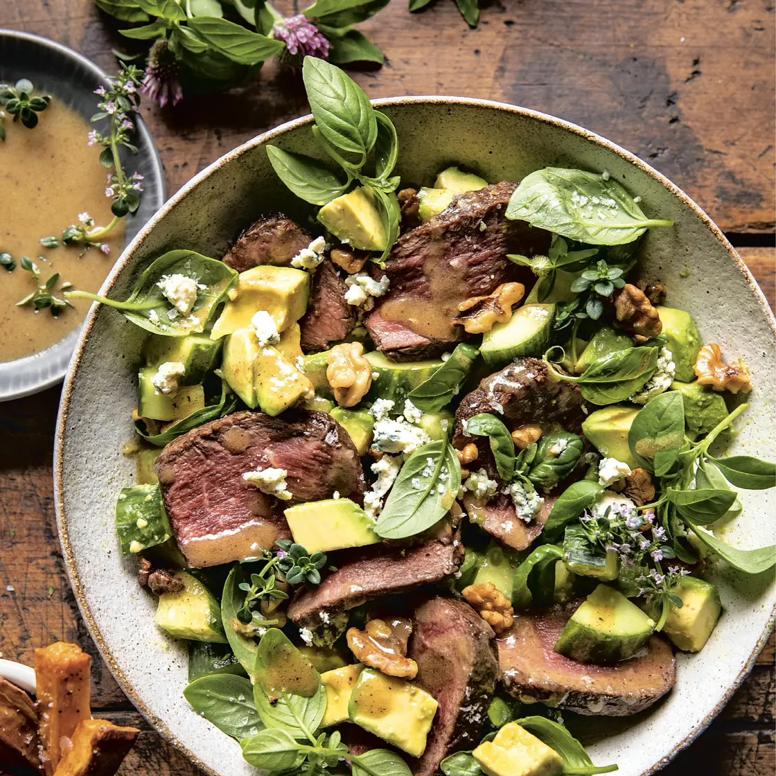 herby avocado steak salad with browned walnuts
