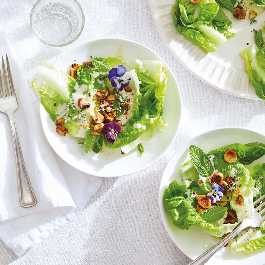 little gem with creamy dressing, hazelnuts, and petals