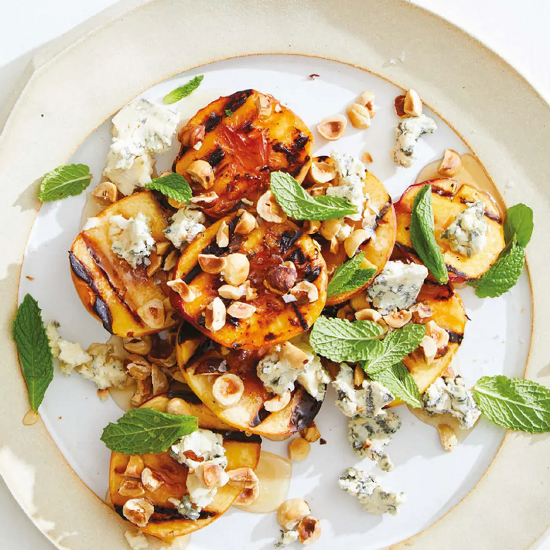 grilled nectarines with gorgonzola, honey, and hazelnuts