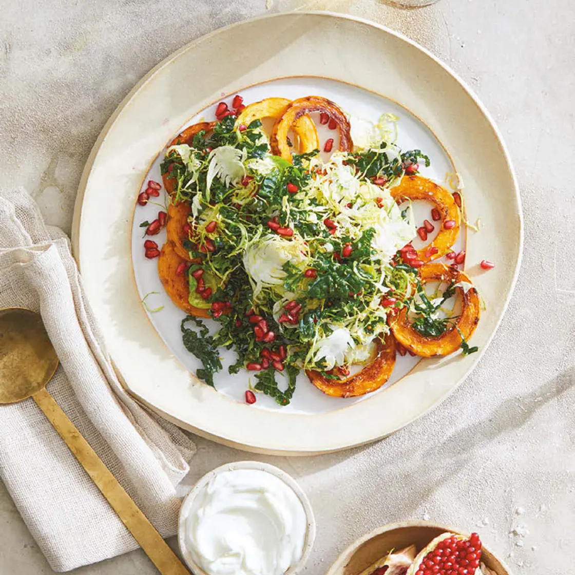 shredded kale and brussels with roasted squash and pomegranate