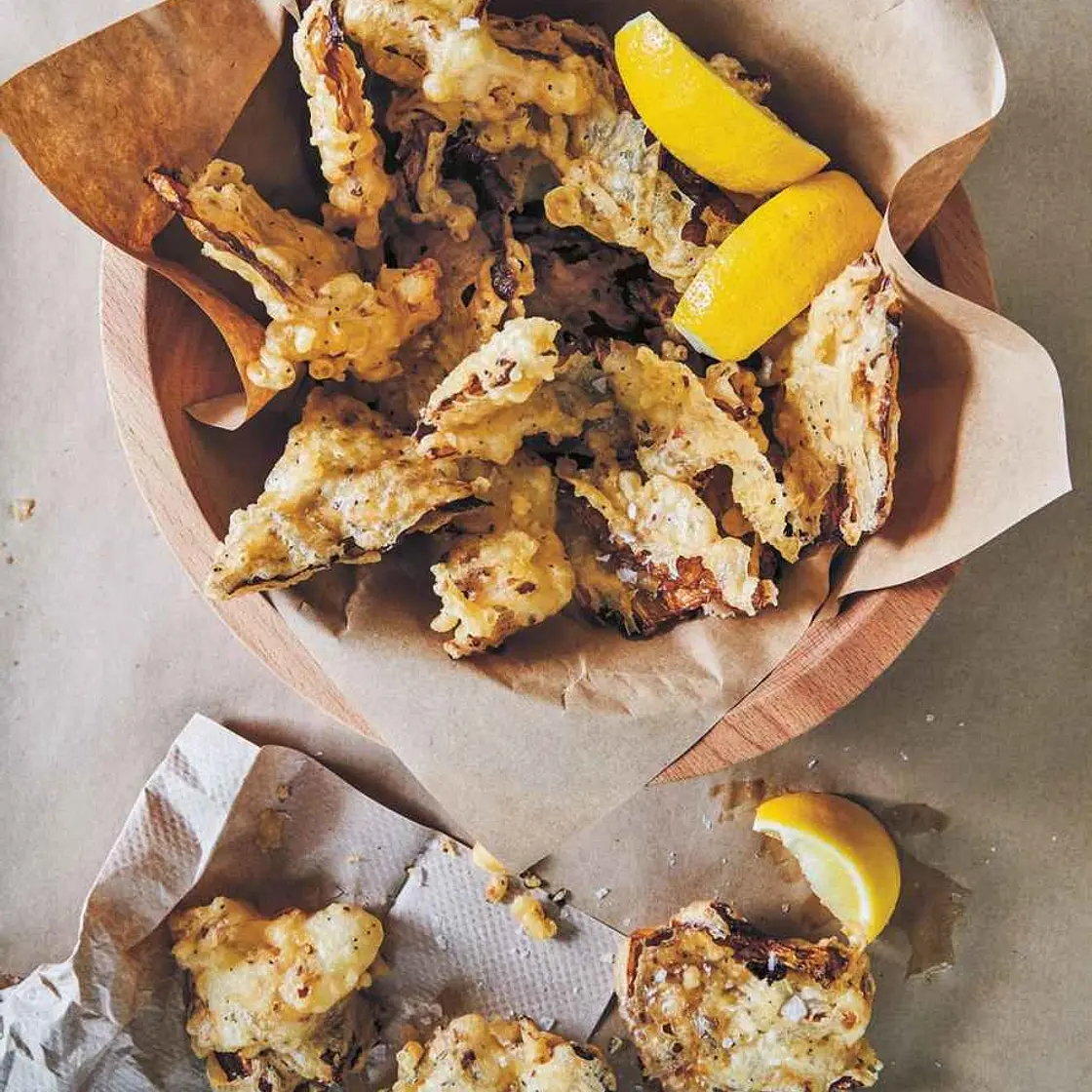 Battered and Fried Cabbage with Crispy Seeds and Lemon