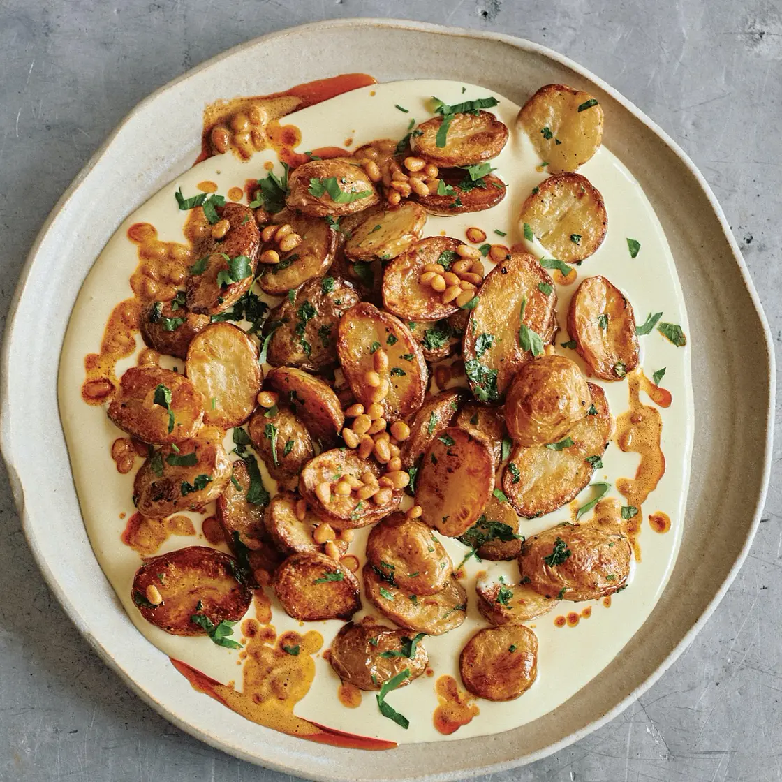 Roasted potatoes with aïoli and buttered pine nuts