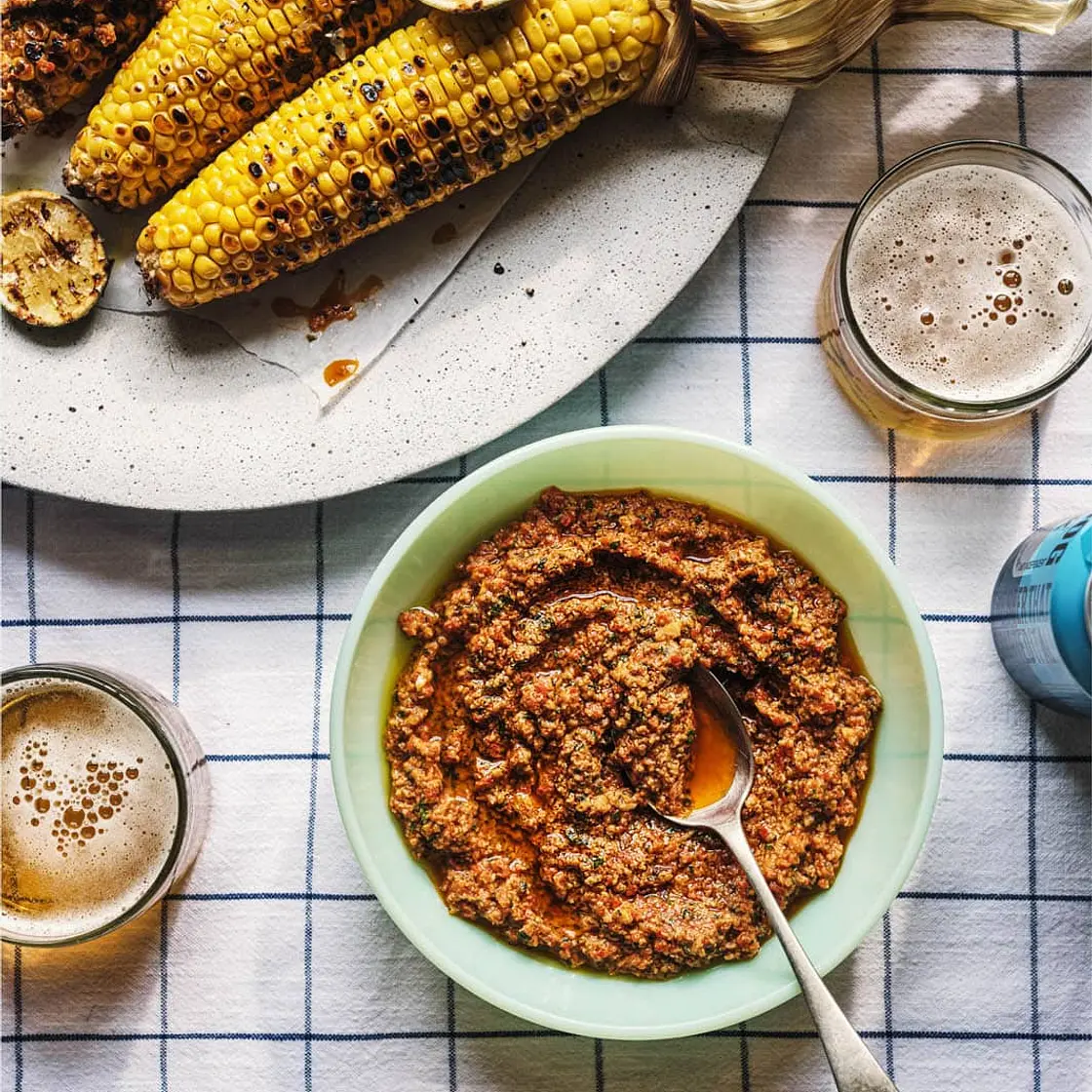 Black pepper-brined corn on the cob with romesco