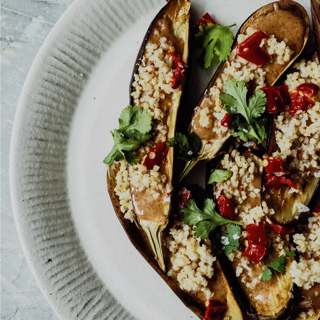 Soft Baked Eggplant with Crispy Millet, Calabrese Peppers & Honey-Almond Drizzle