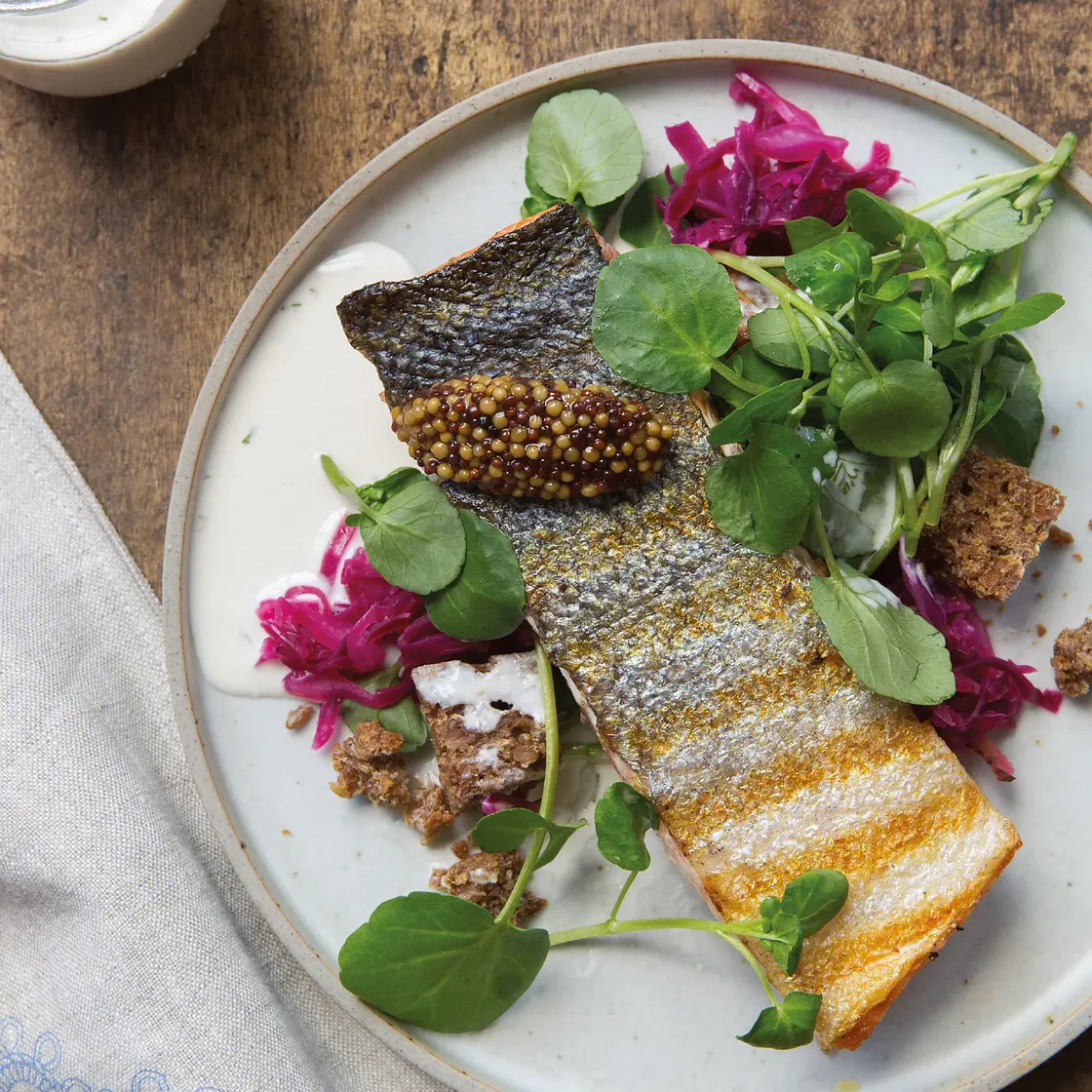 grilled salmon with watercress salad, rye croutons, and buttermilk dressing