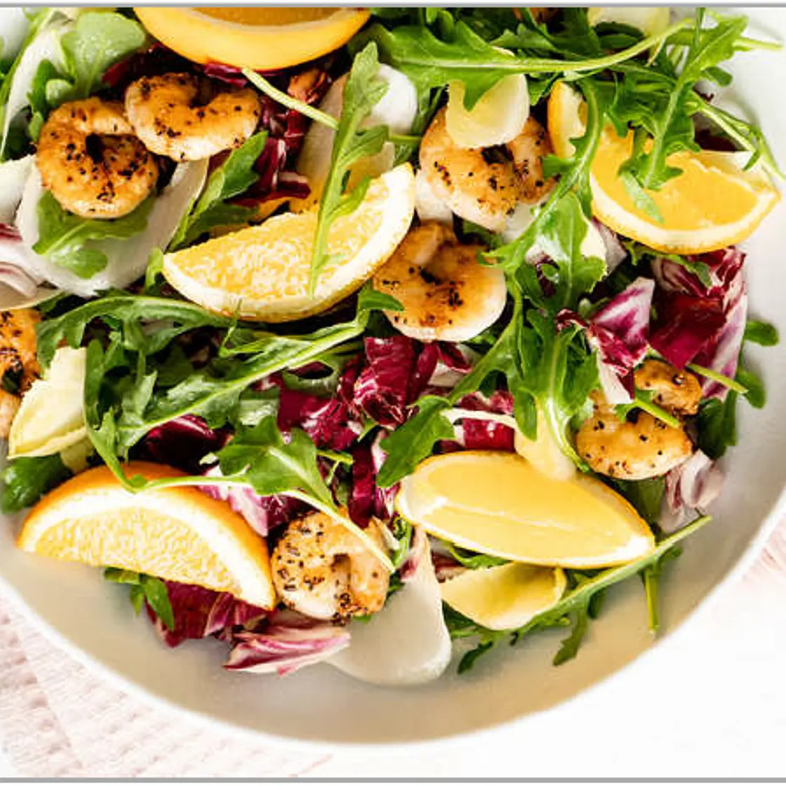Grilled shrimp salad with oranges and mixed greens
