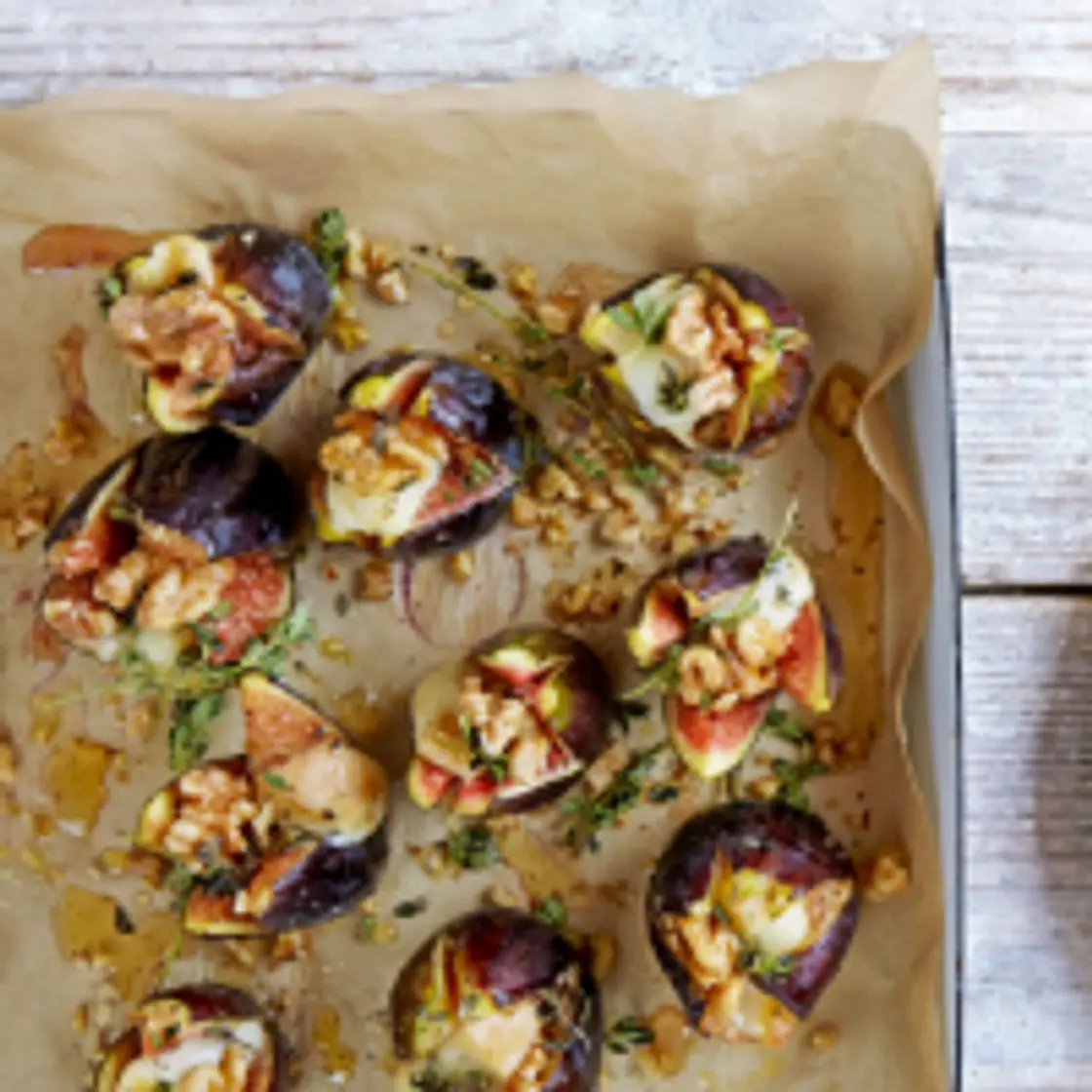 Split figs, stuffed with taleggio, walnuts, thyme & honey