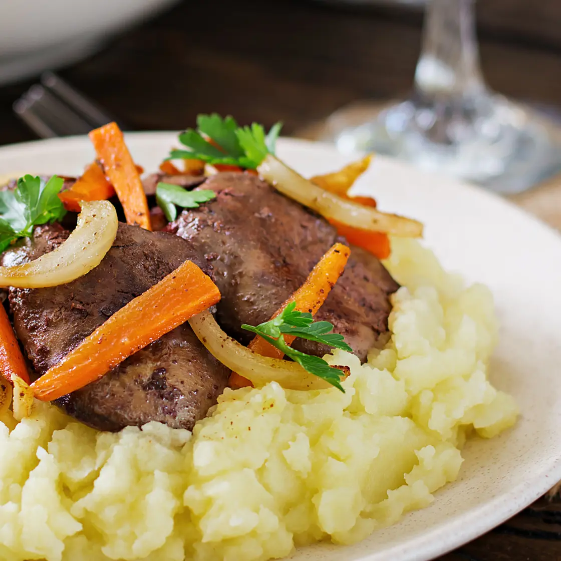 Chicken liver with caramelized onions over mashed potatoes