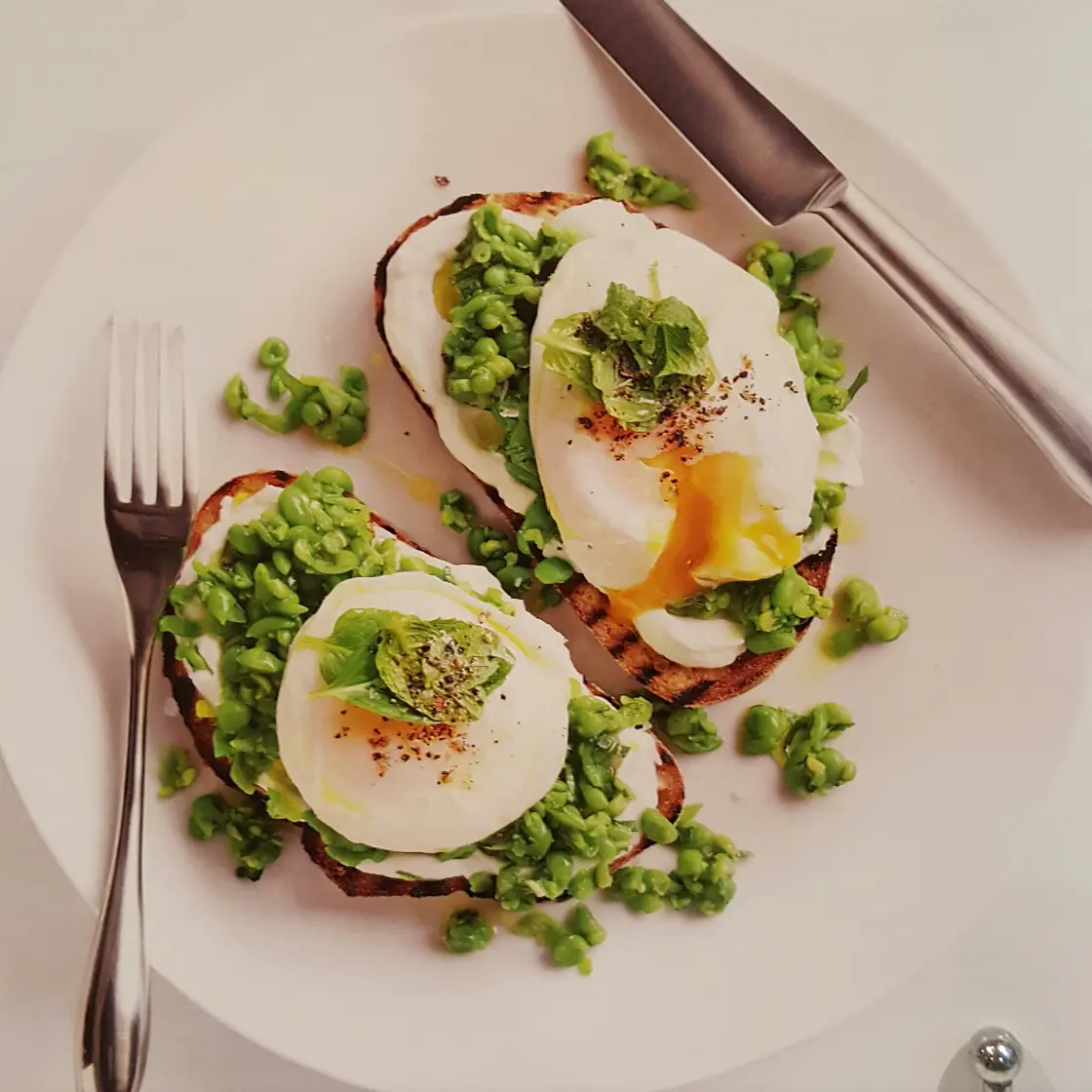 Smashed pea, goat's cheese and egg bruschetta