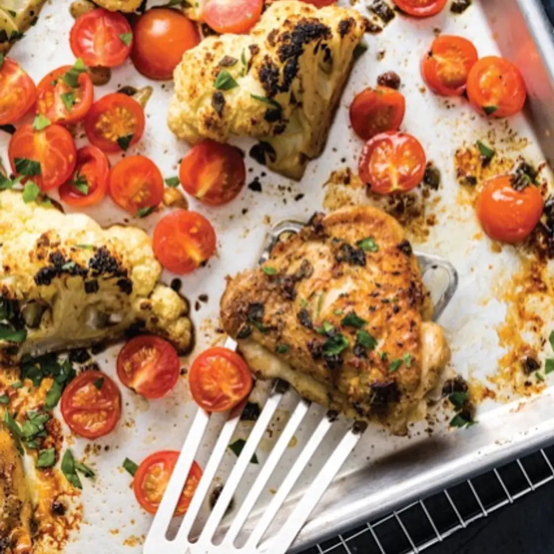 One-Pan Roast Chicken Thighs with Cauliflower and Tomatoes