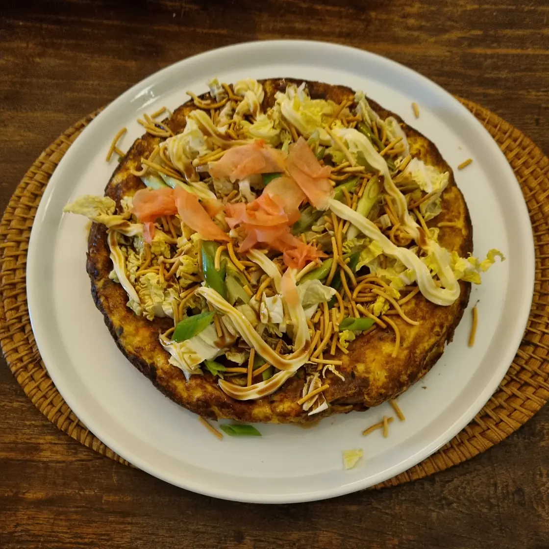 Okonomiyaki with shredded cabbage, daikon and fried noodles