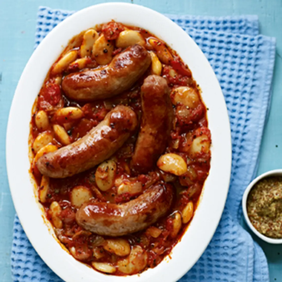 Sausage, tomato and butter bean bake recipe