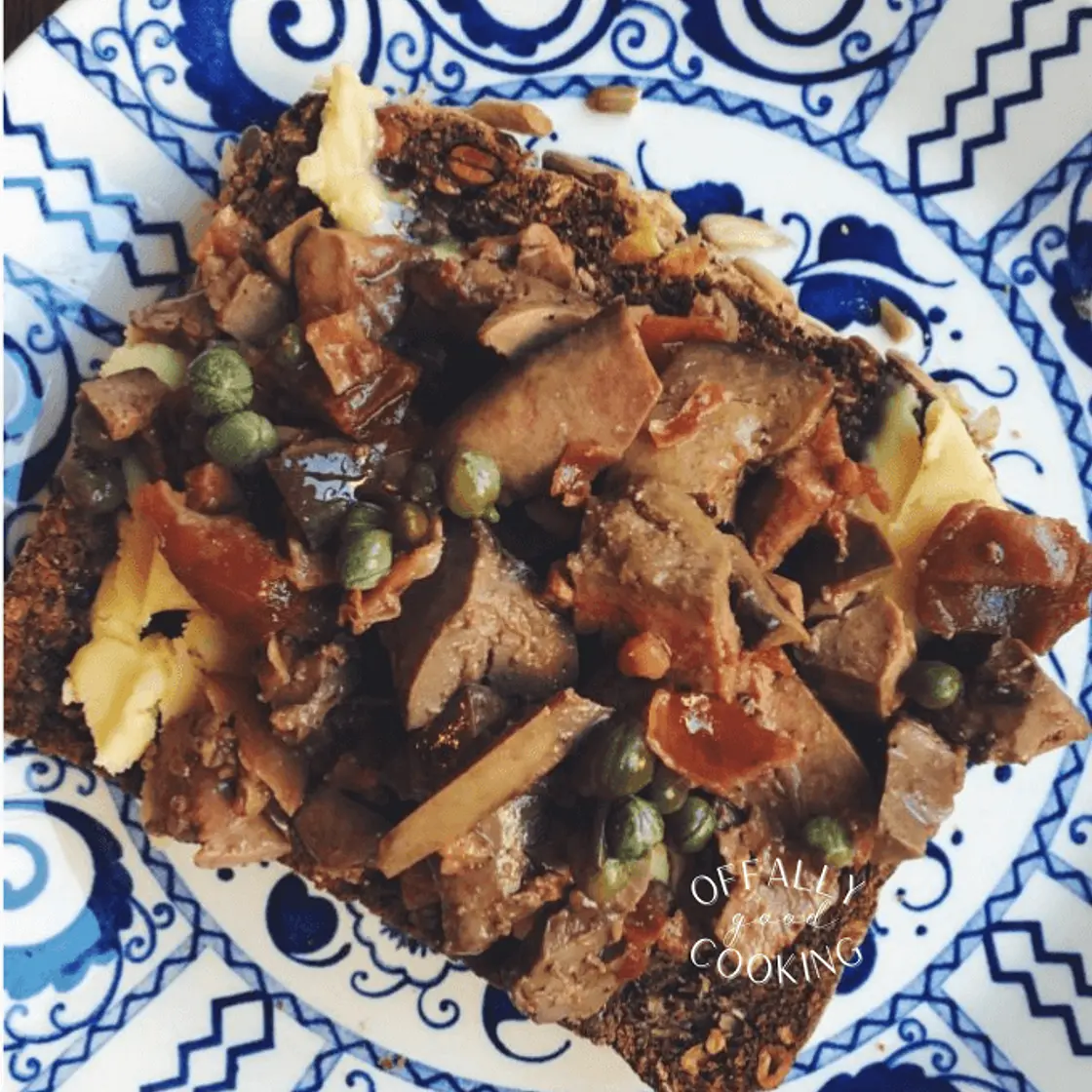 Duck liver and anchovies over buttered toast