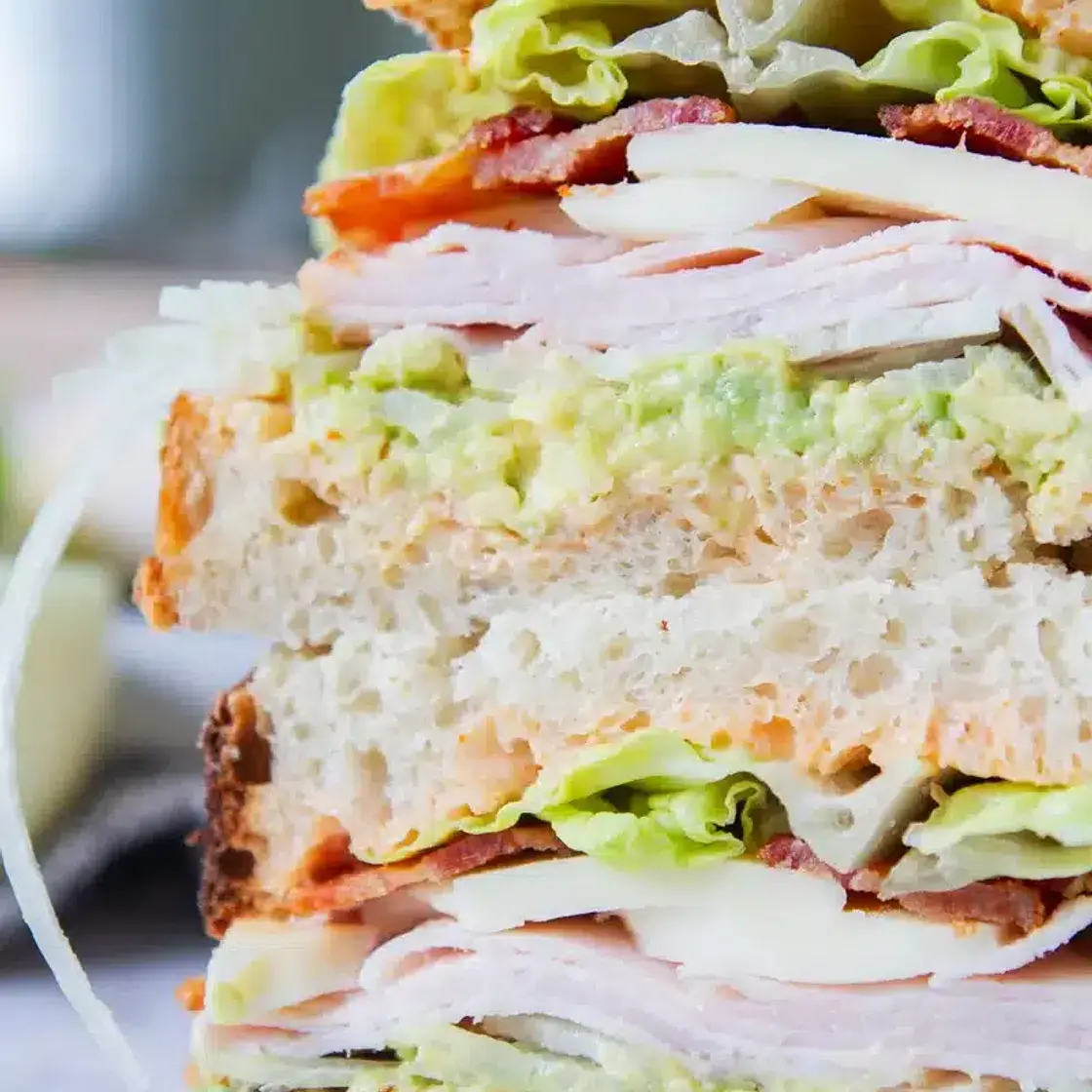 TURKEY AVOCADO CLUB SANDWICH
