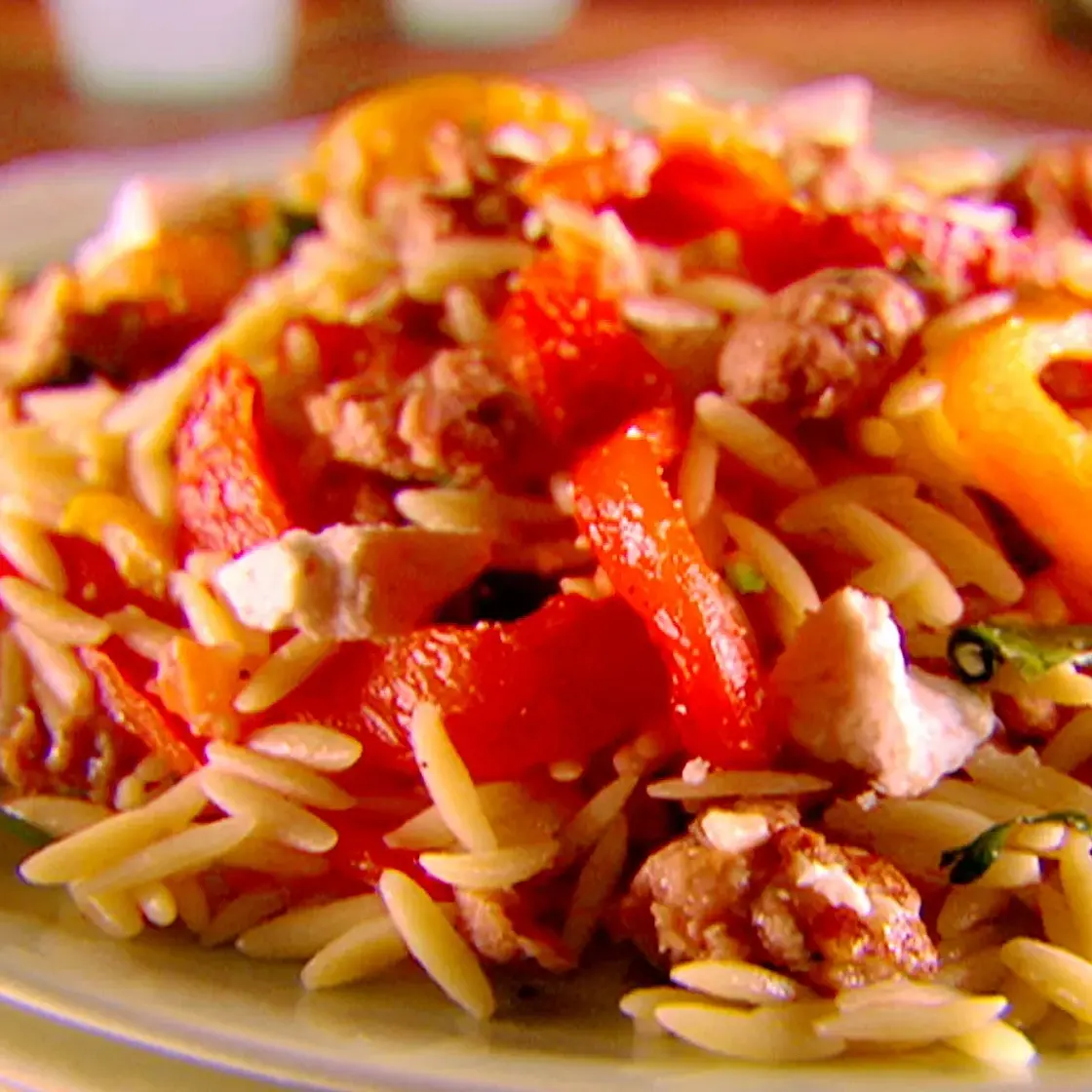 Orzo with sausage, peppers and tomatoes