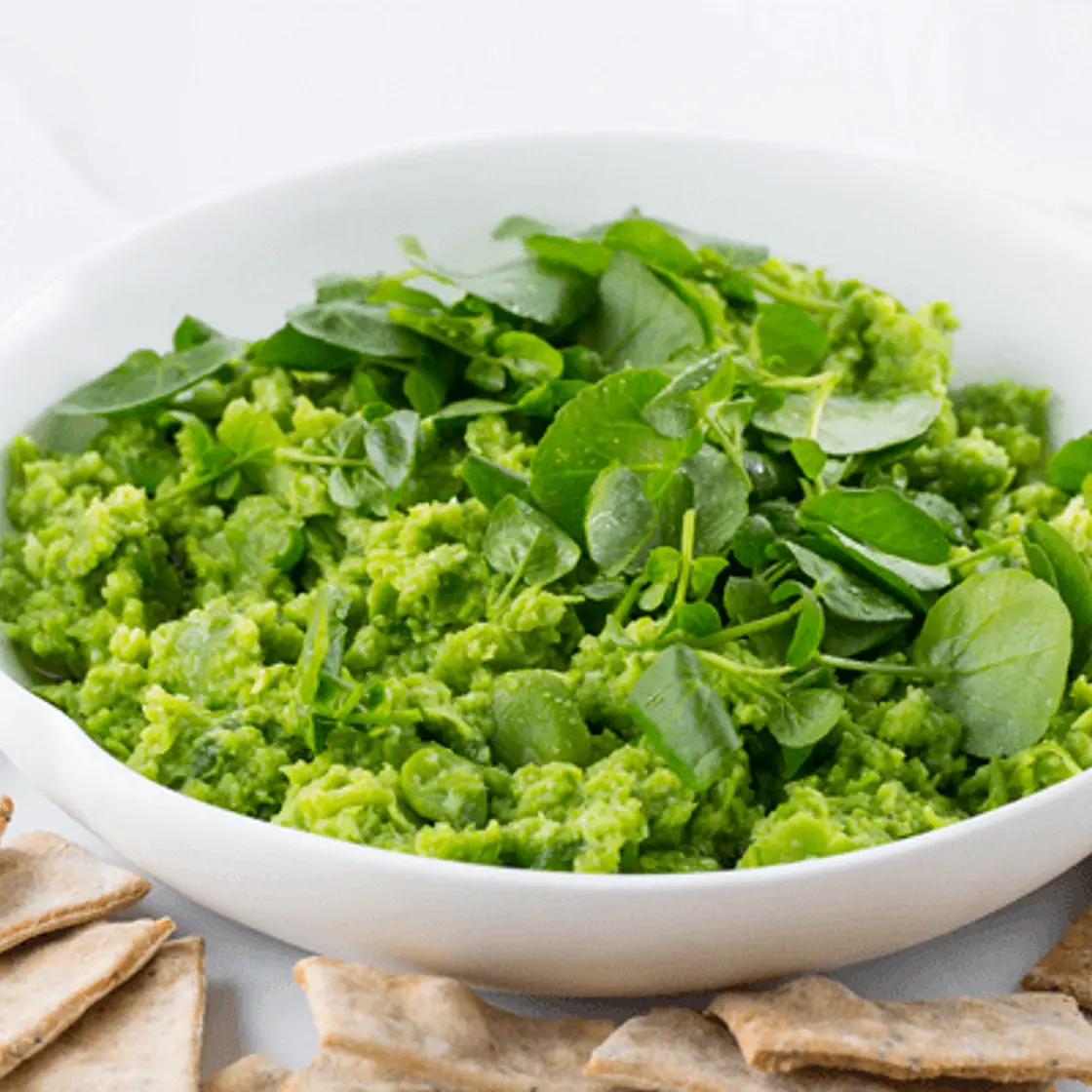 Smashed broad bean and spring onion dip with quinoa and seed crackers