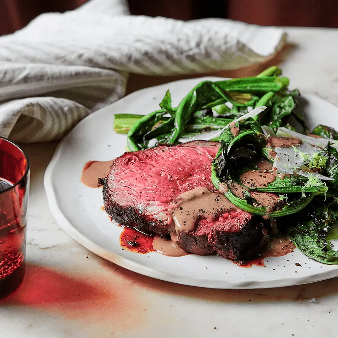 Charred porcini scotch fillet with bitter greens and black garlic bagna cauda sauce