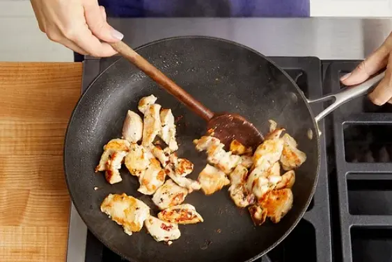 Meanwhile, pat the chicken dry with paper towels; season with salt and pepper. In a medium pan heat a drizzle of olive oil on medium-high until hot. Add the seasoned chicken in an even layer. Cook, without stirring, 3 to 4 minutes, or until lightly browned. Add the red pepper flakes. Cook, stirring occasionally, 3 to 4 minutes, or until the chicken is browned and cooked through. Turn off the heat.