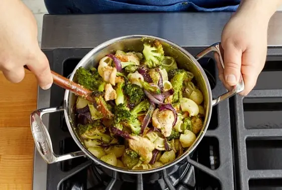 To the pot of cooked pasta, add the cooked chicken, roasted vegetables, pesto, and half the reserved pasta cooking water. Cook on medium-high, stirring constantly, 1 to 2 minutes, or until combined and the pasta is coated (if necessary, gradually add the remaining cooking water to ensure the pasta is thoroughly coated). Turn off the heat. Taste, then season with salt and pepper if desired. Serve the finished pasta topped with the lemon ricotta. Serve any remaining lemon wedges on the side. Enjoy!