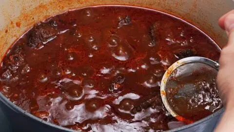 Turn down the heat to low, cover the pot with a lid, and allow this to simmer for 2 hours until the beef can be easily flaked with a fork. Be sure to stir the Hayashi Rice every 20-30 minutes to keep it from burning and if the water level looks too low, add a little more. Skim off any excess fat that's floating on the surface.