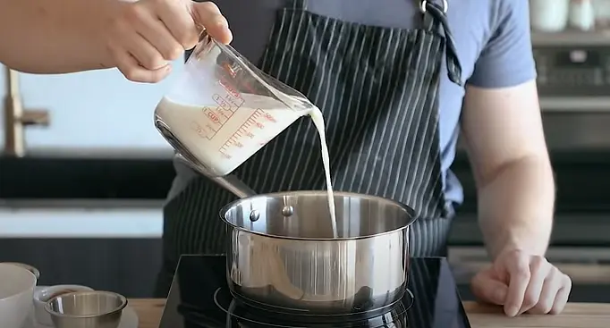 Once chocolate is fully melted, add the rest of your milk slowly while constantly whisking. Continue to heat until all of it is nice and hot.