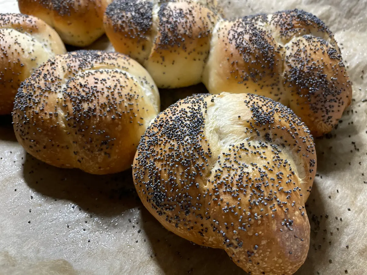 Bake them for 20-25 minutes, until looking golden on the top and hollow sounding if tapped on the bottom. If you know (or think) your oven runs a little hot, make sure you check them at about 20 minutes. Let them cool on the tray, and serve warm with lots of lovely good quality butter!