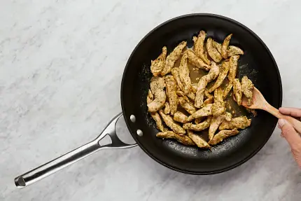 • While garlic buns toast, heat a large drizzle of oil in pan used for veggies over medium-high heat. Add chicken in a single layer; season generously with Italian Seasoning, salt, and pepper. Cook, stirring occasionally, until chicken is browned and cooked through, 4-6 minutes. • Stir in stock concentrate and 2 TBSP water. Season with salt and pepper. • Return veggies to pan; stir to combine. Turn off heat.