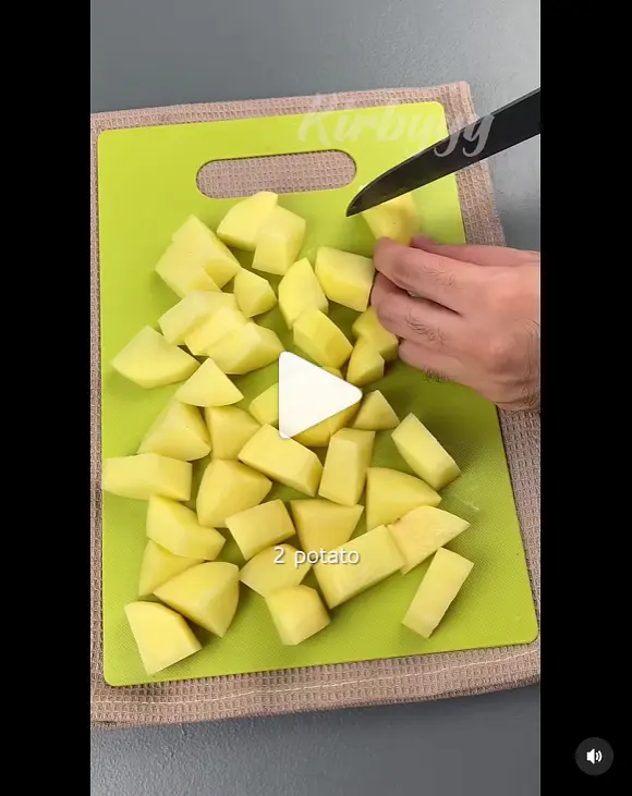 Cut potatoes in half and then into fours.