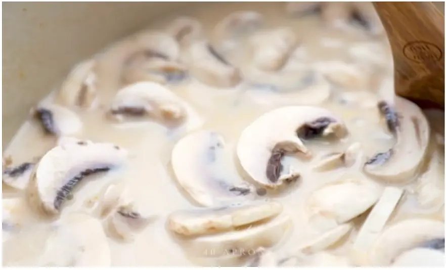 Add in coconut cream or milk, chicken breast (or tofu or shrimp), bamboo and mushrooms. Carrots too if desired.