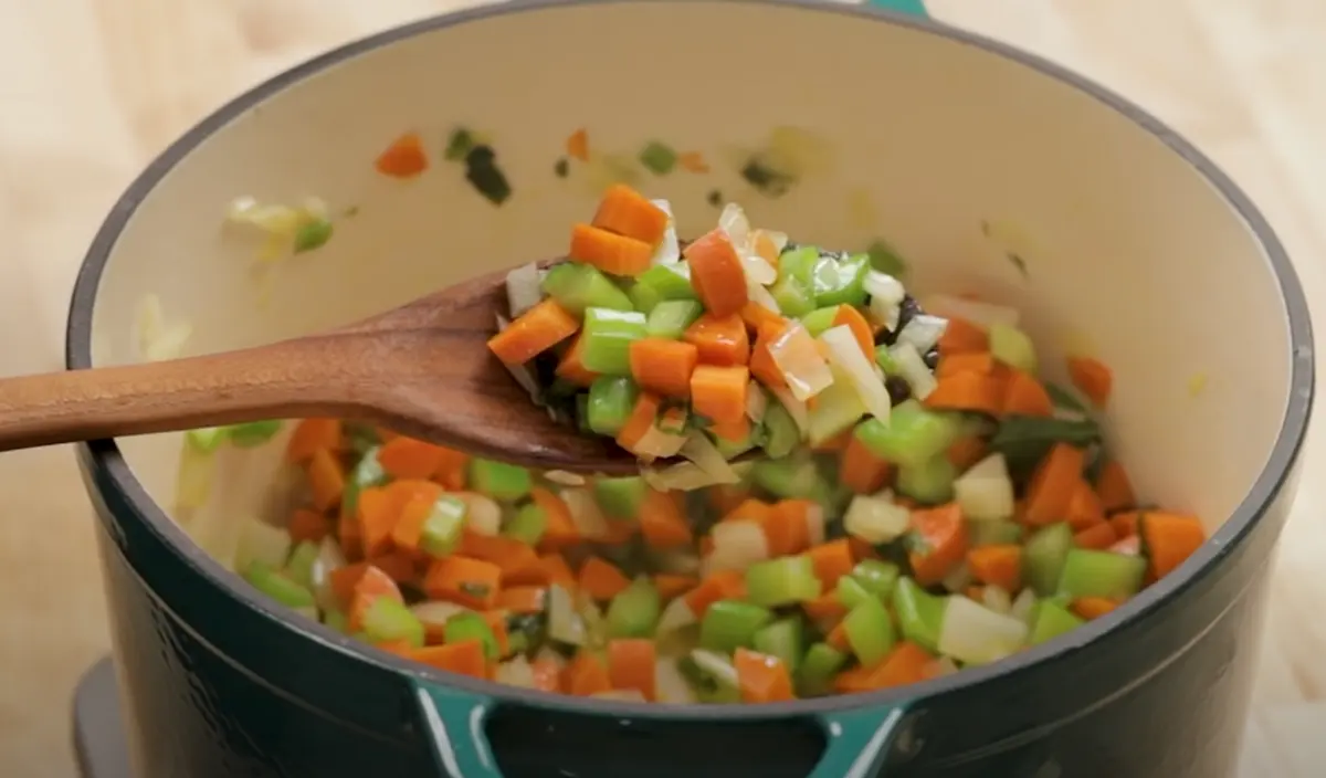 Heat a large pot over medium heat, add enough oil to cover the bottom and wait for oil to heat up, then add your onion, carrots, and celery and cook for about 5 min or until softened slightly.
