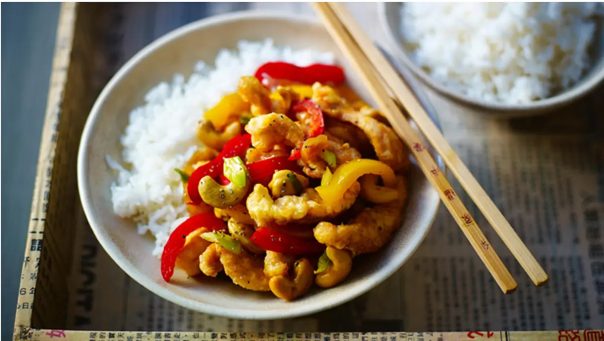 For the chicken, place the egg into a bowl, add the cornflour and a pinch of salt and whisk well to combine. Add the chicken to the mixture and coat well in the egg.