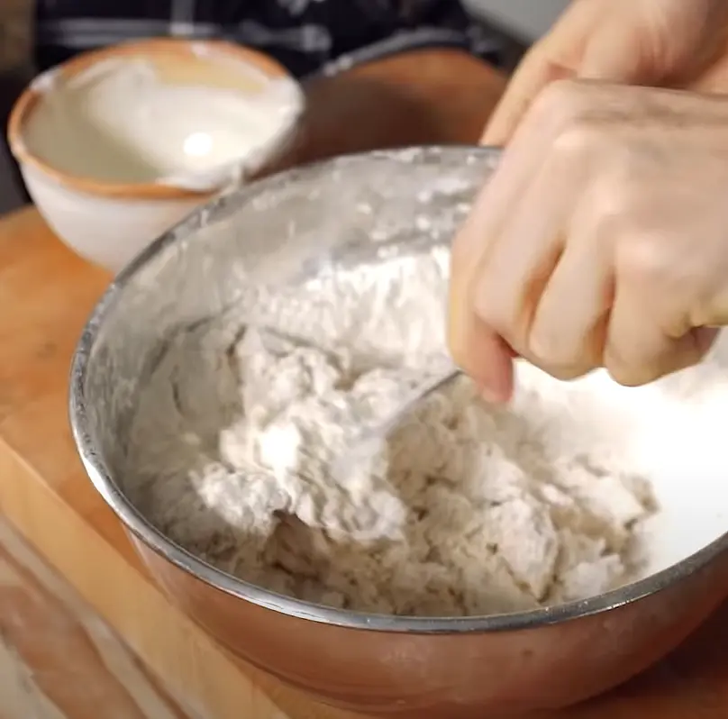 Add yogurt and stir into dough