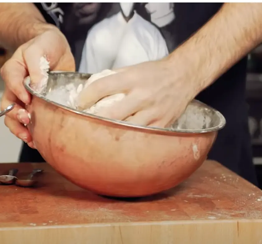 Knead dough, then cover with a damp towel over the bowl and rest on the counter for 1 hour.