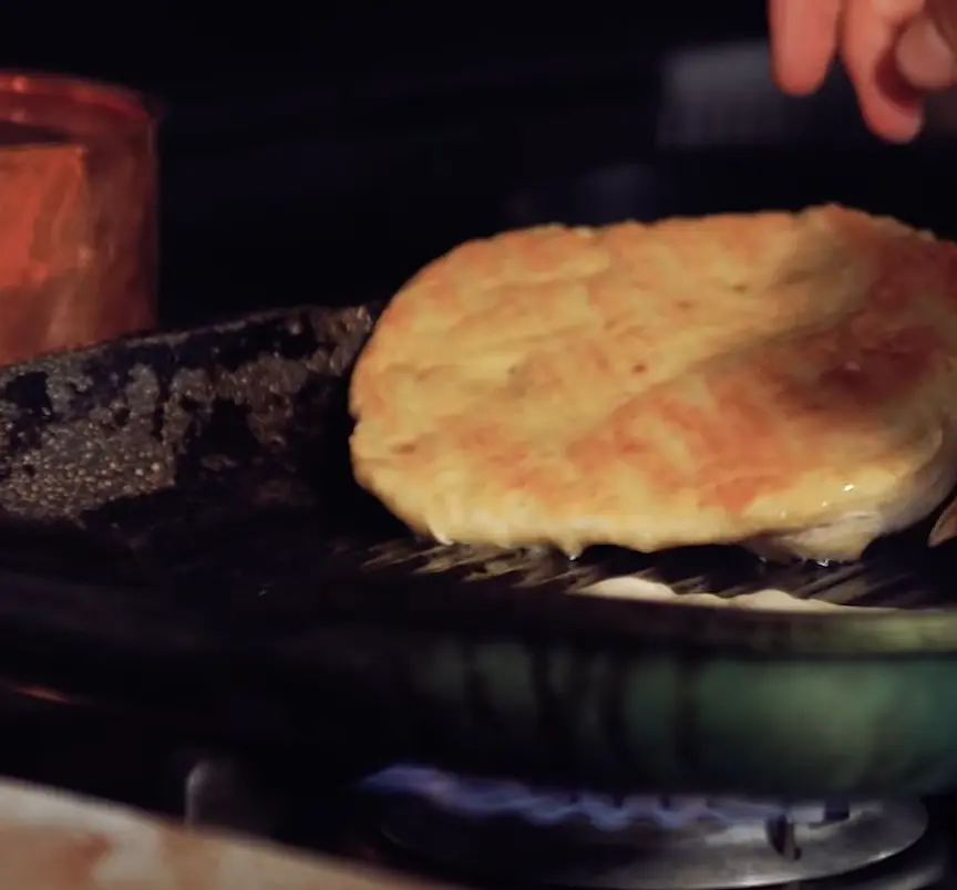 Flip and brown the other side. There should be a crackling sound when the heated pan sizzles the new bread pancakes.