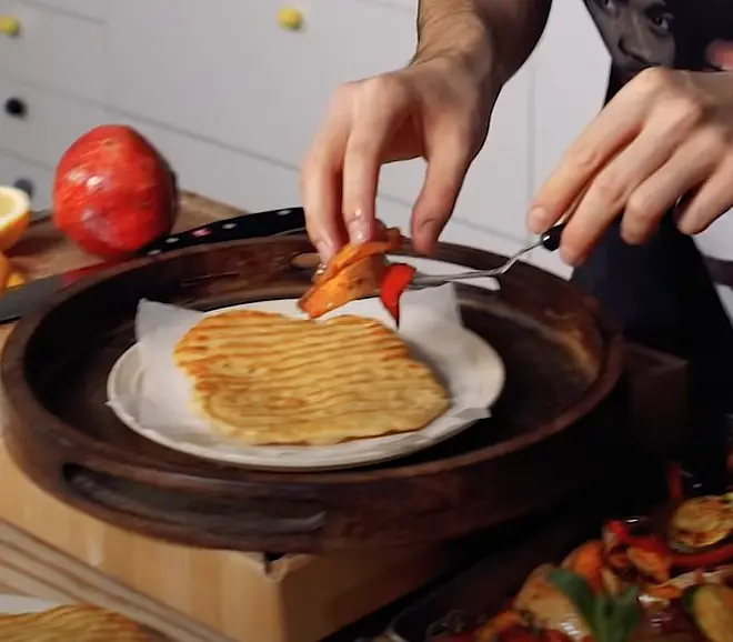 Add roasted vegetables over the flatbread.