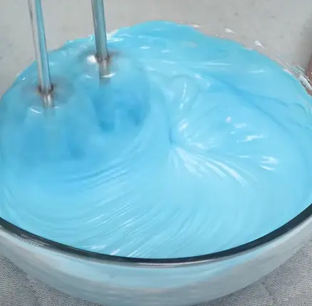 add food colouring and continue stir with egg beator and change to mid-high speed until the wave have become clear