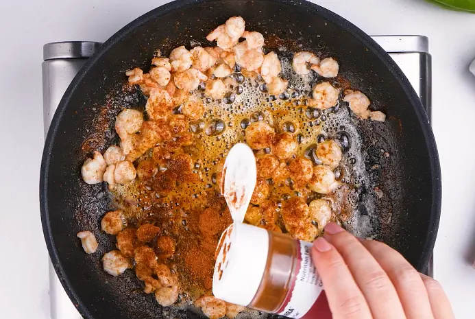 Add shrimp then stir. Add Louisiana Cajun Seasoning and stir until shrimp are evenly coated.