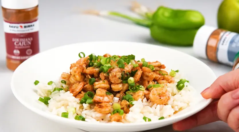 Serve over rice. top with chopped scallions and enjoy!