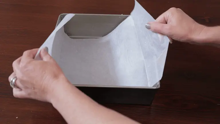 Grease three 23cm x 23cm cake pans with butter, and line them with baking paper. Cut one long piece of baking paper per pan (that extends up two sides of the pan) as this makes getting the cakes out the tins a lot easier once they're baked. The cakes are quite thin, and can break if not removed correctly. If you're unsure of how to do this, you can watch the recipe video above. *Alternatively, you can bake this in one 23cm x 23cm cake tin and slice it into 3 layers if you prefer – refer to notes below!