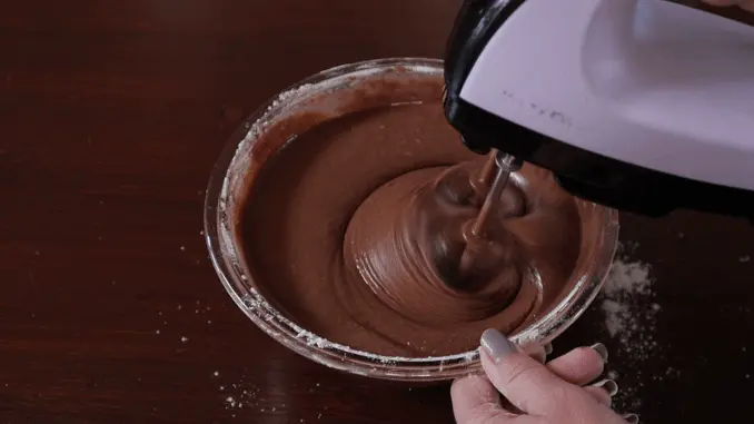 Sift in the flour and cocoa, and beat until there aren't any lumps.