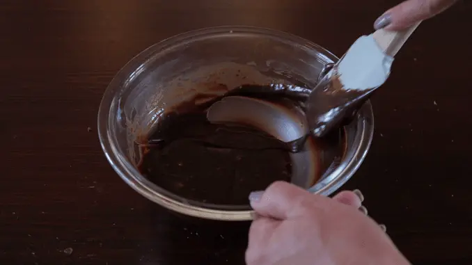 Break the chocolate slabs into blocks and add them to the heated cream, stirring until they've completely melted.