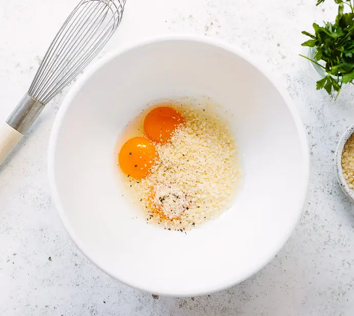 Put the eggs, cheese, salt and black pepper in a large or extra-large bowl. Whisk 1/2 cup of hot pasta cooking water into the beaten egg and cheese mixture. This tempers the eggs so they’re less likely to curdle.