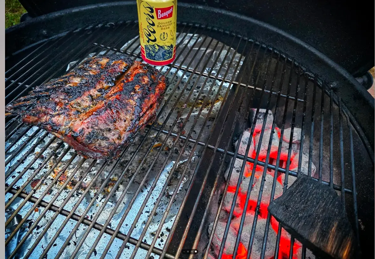 Prep grill coals to one side for hot side. Place a piece of wood on top of the grates for the wood smoke. The other half is cold side where you will place the lamb to smoke for 45 minutes