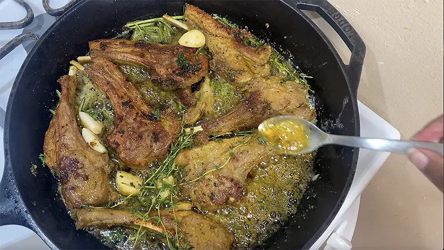 COOK LAMB: In skillet, heat up 3 Tbsps of oil and add lamb chops allowing it to sear 2-4 minutes per side. When flip over to other side, add butter, thyme sprigs, rosemary sprigs and garlic cloves to the skillet. Baste lamb chops with butter from the skillet.