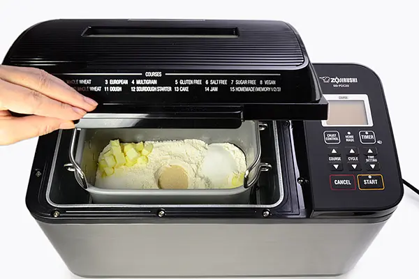 Following the instruction manual, prepare the dough using the ingredients listed.