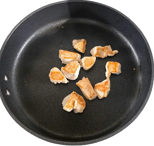 Heat a non-stick skillet over medium-high heat with a small amount of oil. Add the chicken and cook for 5–7 minutes until golden brown and cooked through. Remove from the pan and set aside.