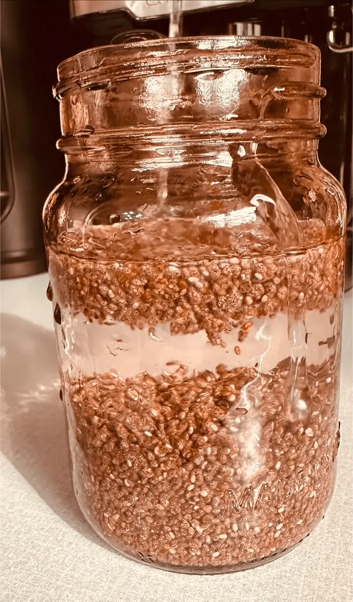 Put the 4 teaspoons of chia in a cup full of water (whatever temperature is fine). Leave it to soak for 7 minutes or until softened.