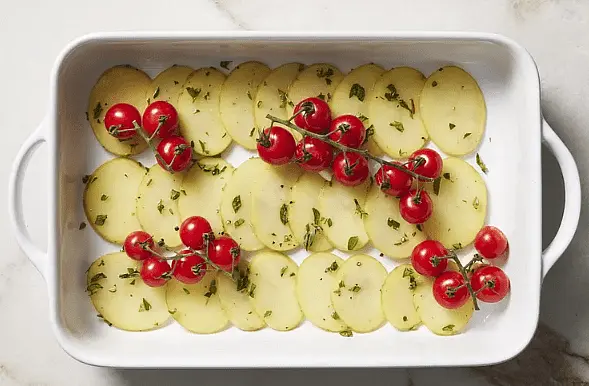 Roast until tomatoes are juicy and potatoes are tender, about 25 minutes. Remove from oven.