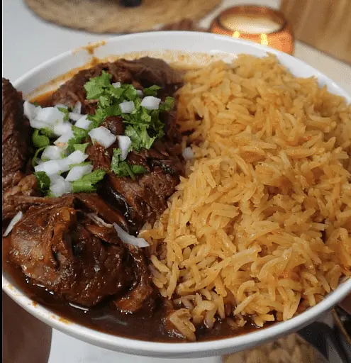 Birria Bowls - Serve the shredded beef over a bed of fluffy white or Mexican rice, ladle generous spoonfuls of warm consomé over the top, and finish with fresh toppings (like a fried egg)